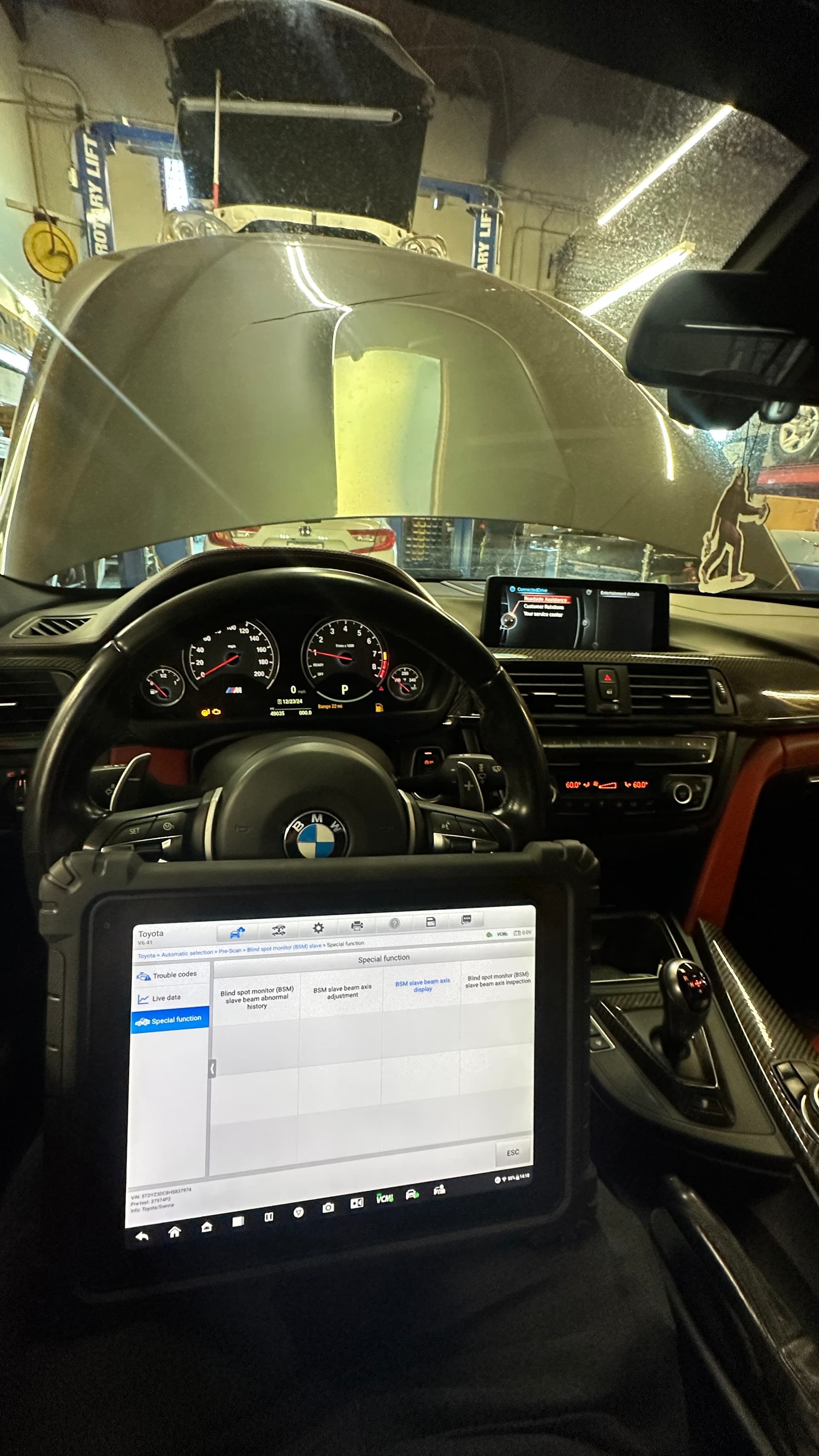 Technician running a diagnostic scan on a vehicle